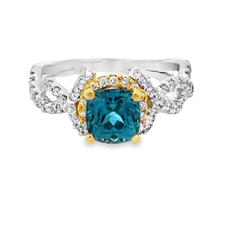 18Kt White and Yellow Gold Ring set with 2.13ct Round Blue Zircon and .54tw Diamonds, VS clarity and G-H color. Stock size 6 can be sized.  Dimensions; 8.4mm X 11mm top, 2.1mm shank