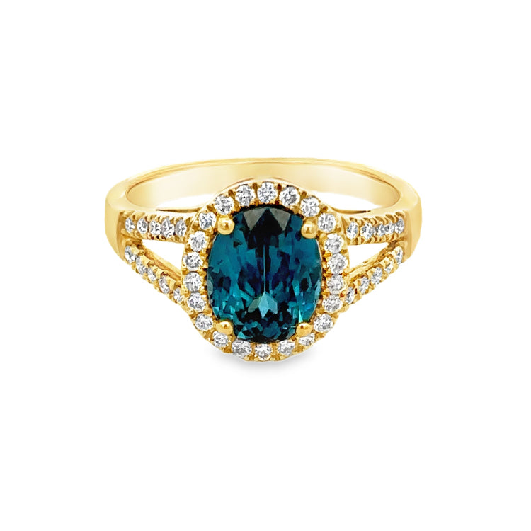 14Kt Yellow Gold Ring set with 2.46ct Oval Blue Zircon and .31tw Diamonds  Dimensions; 11mm X 10mm top, 2.5mm shank