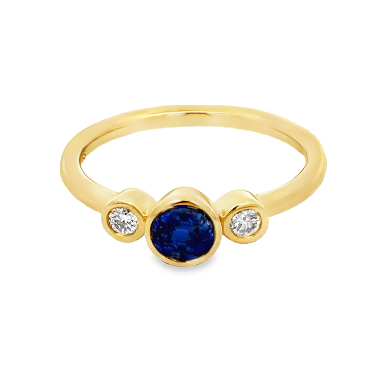 14Kt Yellow Gold Bezel-set, 3 Stone Ring with .48Ct Round Blue Sapphire Center stone and .10tw Diamond side stones. Stock size 6.25 can be sized to order.  Dimensions;&amp;nbsp; 5.42mm diameter top, 1.8mm shank, 4.11mm high from top of finger.