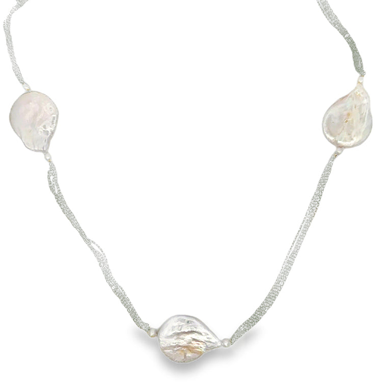 A 32-inch necklace featuring five strands of sterling silver with teardrop-shaped baroque freshwater pearls and semi-round freshwater pearls.