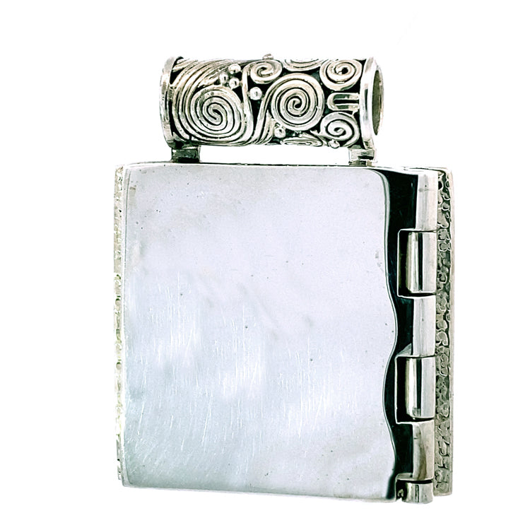 reverse side of Sterling Silver and Fossilized Ivory, Dolphins Playing Locket by Zealandia