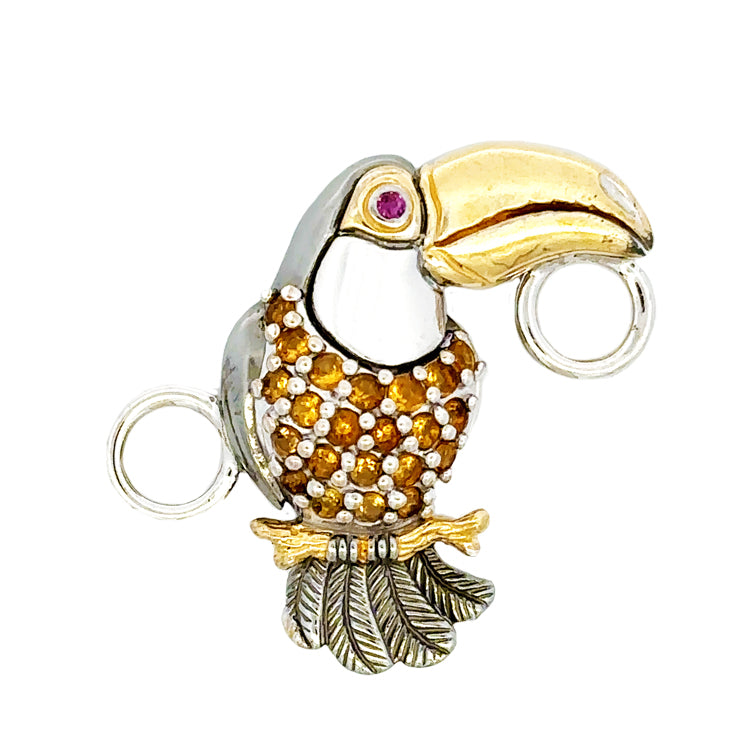   Kovel&#39;s Toucan Bracelet Topper features a  Citrine body and Ruby eye set in 925 Rhodium Silver with 18Kt Gold Accent Plating. This exquisite piece measures 1-1/4&quot; long and 1-1/4&quot; wide.   