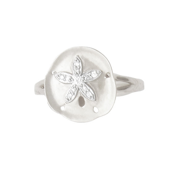 14Kt White Gold Convex Sand Dollar Ring with .04TW diamonds in raised center star. Dimensions; 13mm diameter. Stock size 6.5, can be sized to order.