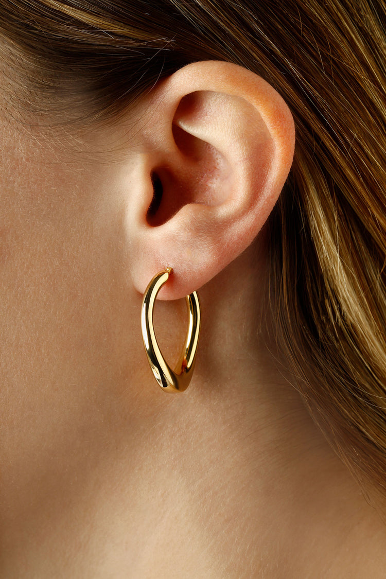 14kt Yellow Gold Offset &quot;U&quot; Hoop Earrings with Snap Down Posts on Model. Dimensions; 1&quot; long x 7/8&quot; wide