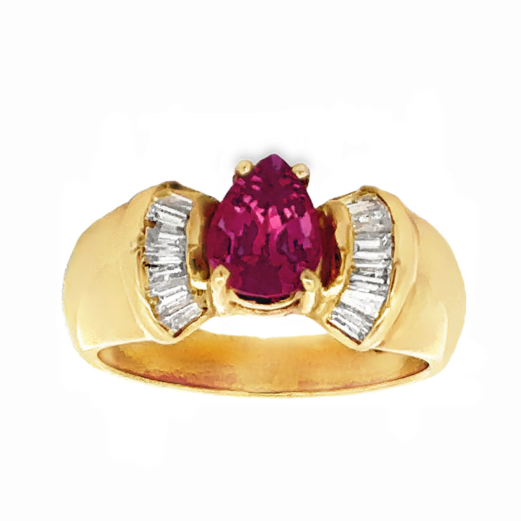 14Kt yellow gold ring featuring a prong-set, .92ct Pear Shape Fancy Pink Ceylon Sapphire flanked by.45tw baguette cut Diamonds. Stock size 7, can be sized to order.  Dimensions; Top of ring is 8.5mm wide and taoers to 4mm at the base of the shank.