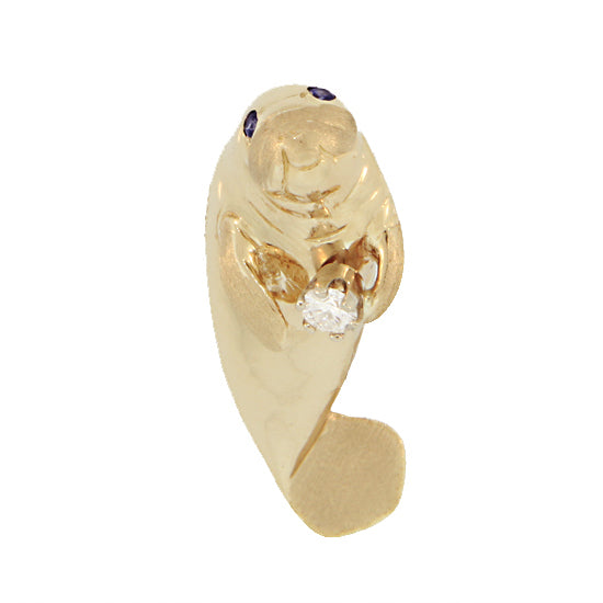 yellow gold upright manatee pendant with a diamond in its flipper. 