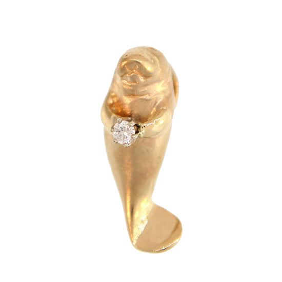 Gold upright manatee with a diamond in its flippers