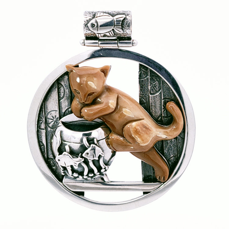 Sterling Silver and Fossilized Walrus Tusk Ivory &quot;Mischief&quot; Cat with Fish Bowl Pendant by Zealandia. Due to the Natural color variation of Fossil material, Ivory color can vary and may be darker or lighter than pictured.  Dimensions: 1 3/4&quot; Drop, 1 1/2&quot; Width