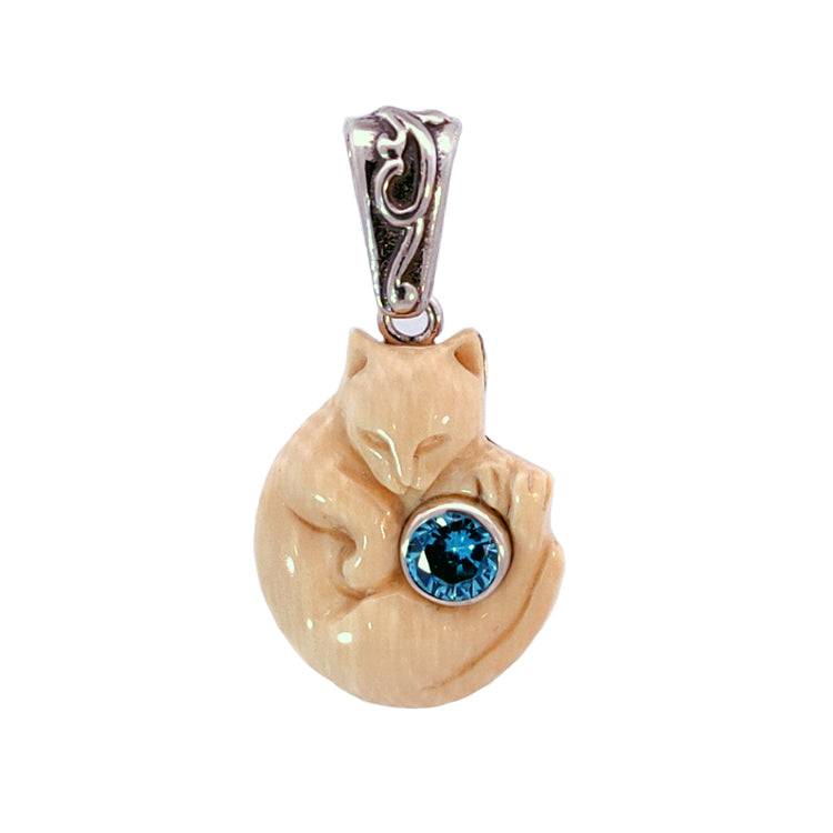 &quot;Cozy Cat&quot; Fossilized Mammoth Ivory and Blue Topaz Sterling Silver Pendant by Zealandia. Due to the Natural color variation of Fossil material, Ivory color can vary and may be somewhat darker or lighter than pictured.  Dimensions:  7/8&quot; Long, 1/2&quot; Wide, 1-1/4&quot; Drop