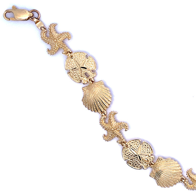 14Kt Yellow Gold Seashell Bracelet Featuring Starfish, Scallops and Sand dollars.  7.50" long with Lobster claw clasp